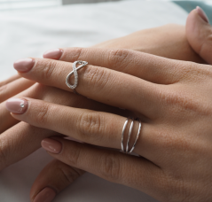 MINET Stříbrný prsten INFINITY s bílými zirkony vel. 50